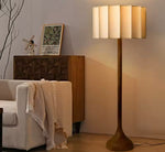 Led Elephant's Foo lampshade 
Hand turned Parota wood base.
Fabric-lined lampshade with fiberglass and polystyren