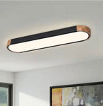 Lumin 38 in. W 1-Light Black and Wood Integrated LED Flush Mount Minimalist Long Oval Ceiling Light for Hallway/Kitchen