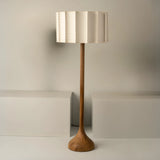 Led Elephant's Foo lampshade 
Hand turned Parota wood base.
Fabric-lined lampshade with fiberglass and polystyren